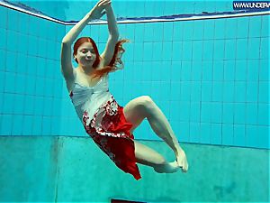 molten polish red-haired swimming in the pool